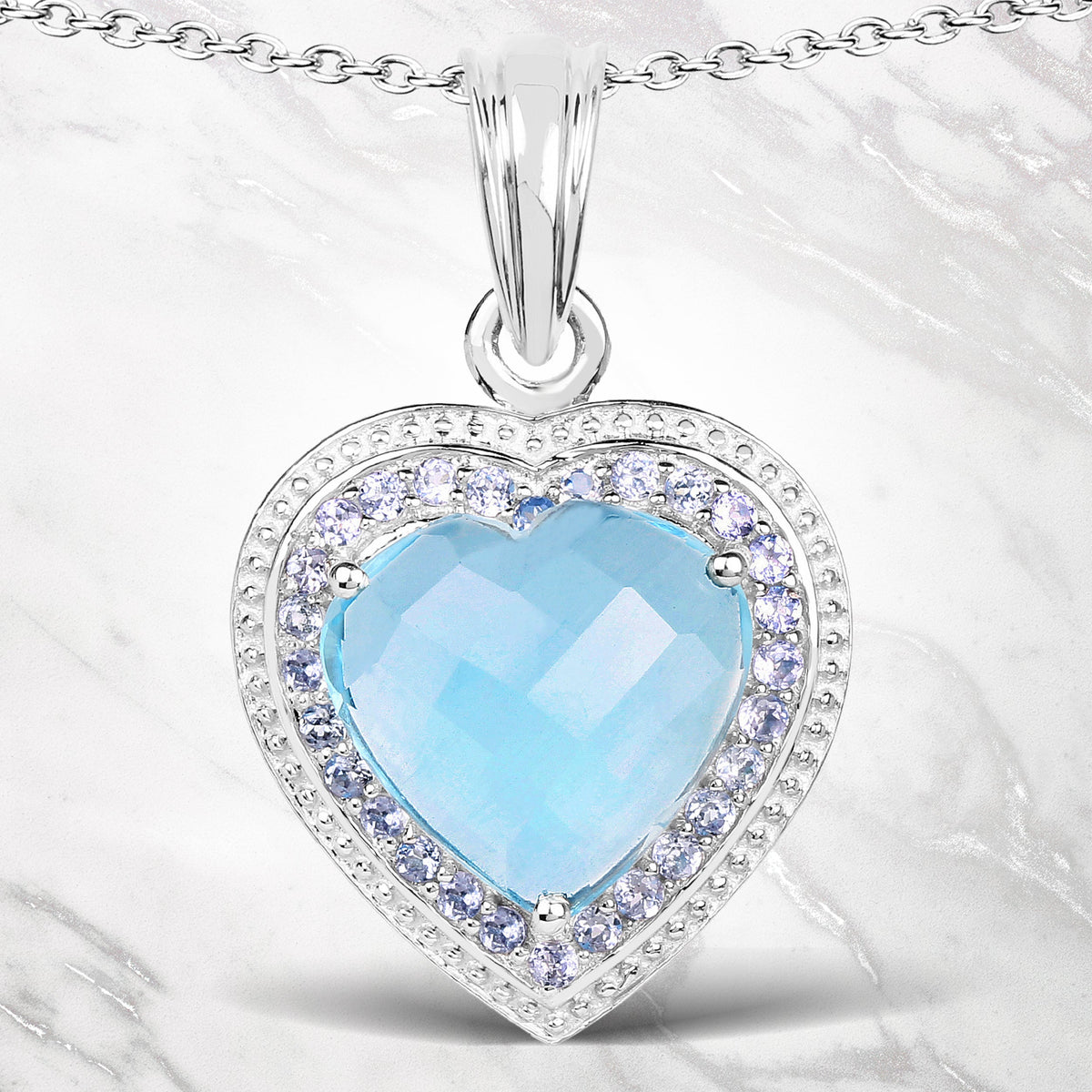 Dije de plata esterlina .925 con topacio azul genuino de 7,36 quilates y tanzanita