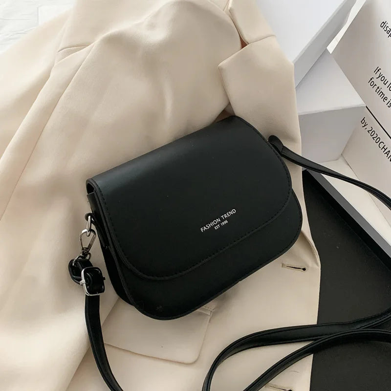 Trendy Saddle Shoulder Bag for Women | Sophisticated PU Leather Crossbody | Simple Solid Color Flap Messenger Bag | Fashion-Forward Designer Pouch for Versatile Daily Matching Luxegan