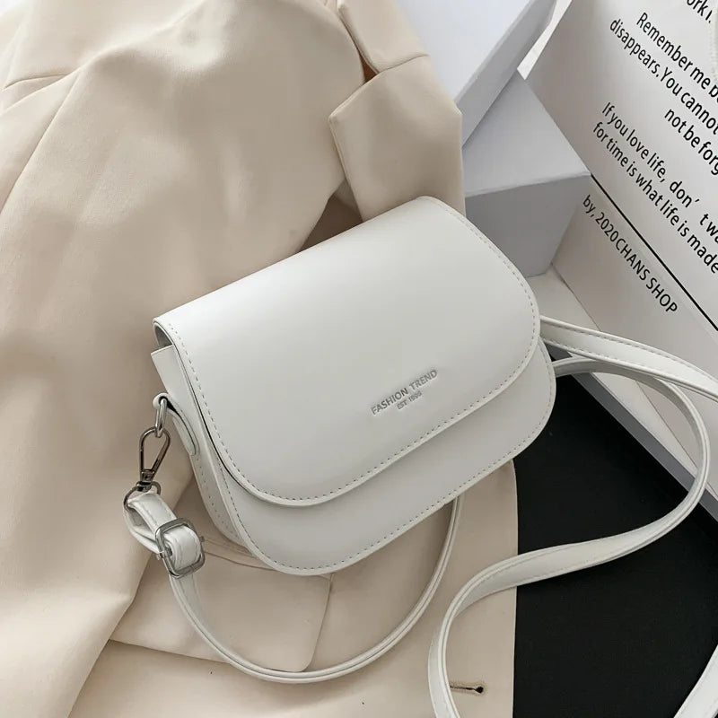 Trendy Saddle Shoulder Bag for Women | Sophisticated PU Leather Crossbody | Simple Solid Color Flap Messenger Bag | Fashion-Forward Designer Pouch for Versatile Daily Matching Luxegan