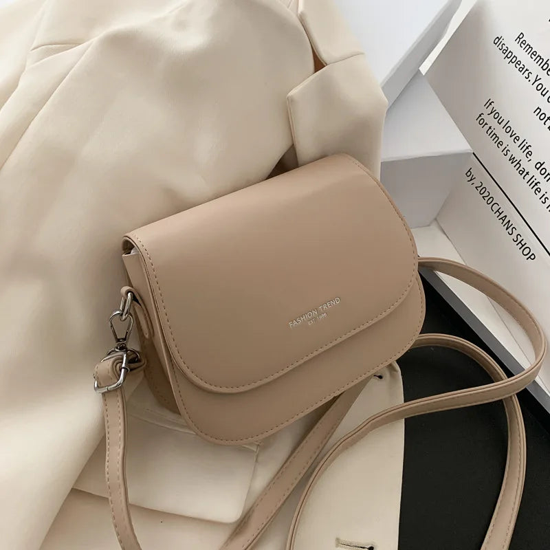Trendy Saddle Shoulder Bag for Women | Sophisticated PU Leather Crossbody | Simple Solid Color Flap Messenger Bag | Fashion-Forward Designer Pouch for Versatile Daily Matching Luxegan