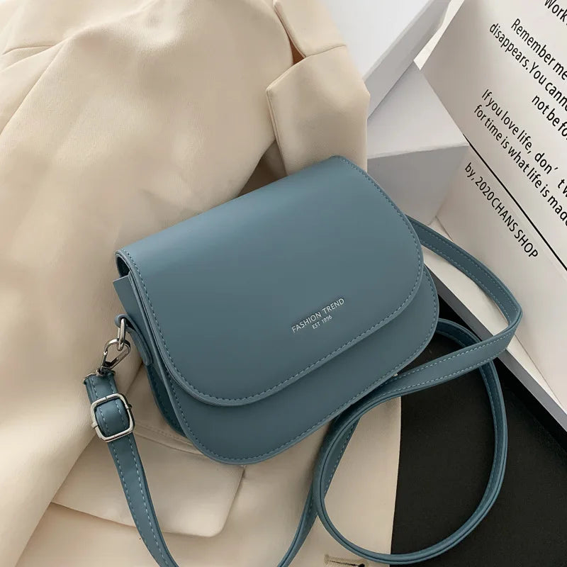 Trendy Saddle Shoulder Bag for Women | Sophisticated PU Leather Crossbody | Simple Solid Color Flap Messenger Bag | Fashion-Forward Designer Pouch for Versatile Daily Matching Luxegan