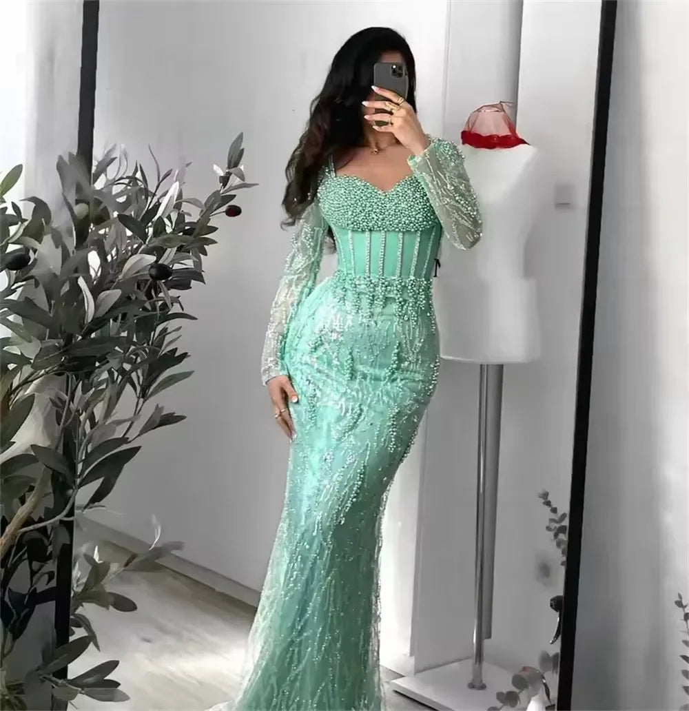 Luxury Mint Green Mermaid Evening Gown | Dubai Heavy Beaded Pearls Formal Party Dress | Exquisite Long Sleeve Illusion Corset Prom Gown | Sequin Satin Ankle-Length Trumpet Dress Luxegan
