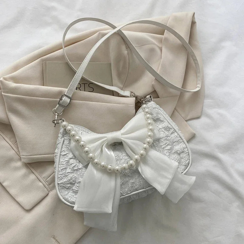 White Folds Pop Retro Bow Bag | Female Pearl Handle New Fashion Pearl Armpit Shoulder & Crossbody Bag Luxegan
