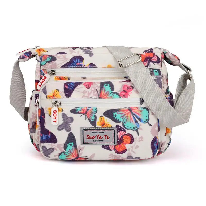 Women’s Floral Multi-Pocket Crossbody Handbag | Waterproof Canvas Shoulder Messenger Bag | Large Capacity Nylon Travel Bag for Hiking & Shopping | Durable Casual Floral Purse (Model 190417065127) Luxegan