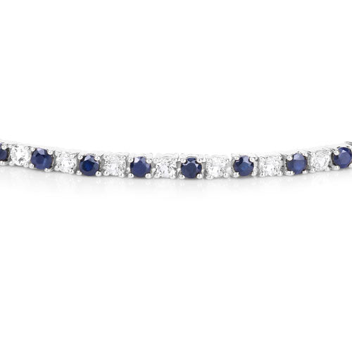 Brazalete de zafiro azul y topacio blanco de 6.87 ct. p.t. en plata de ley