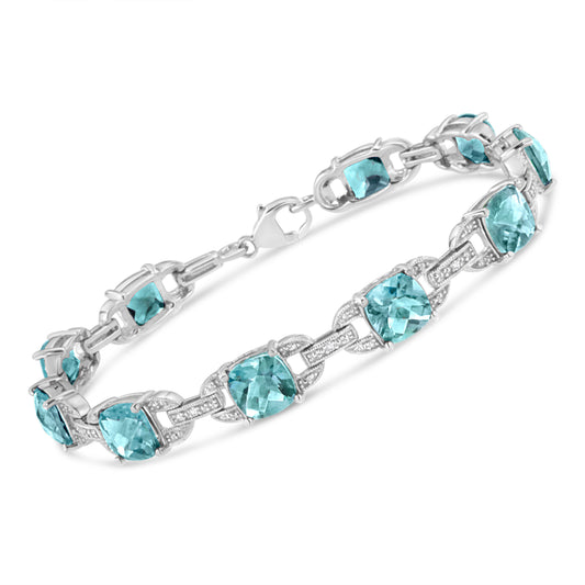 Pulsera de tenis de moda de plata de ley .925 con topacio azul de talla cojín de 7x7 mm y diamantes redondos de 1/20 quilates (Color I-J, Claridad I1-I2) - 7"