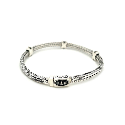 Pulsera de cuerda trenzada con detalles de zafiro negro en plata esterlina