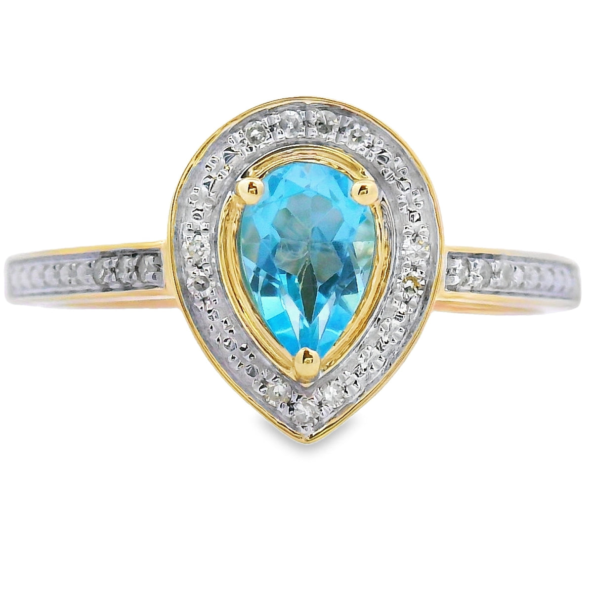 Anillo de topacio azul y diamantes de .54 ct en oro amarillo de 10 qt