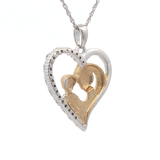 Colgante de corazón de diamantes de .10 ct y plata de ley