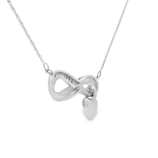Colgante religioso de cruz con diamante de .04ct de plata de ley