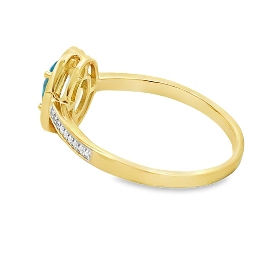 Anillo de topacio azul y diamante de 0,49 qt en oro amarillo de 10 kt