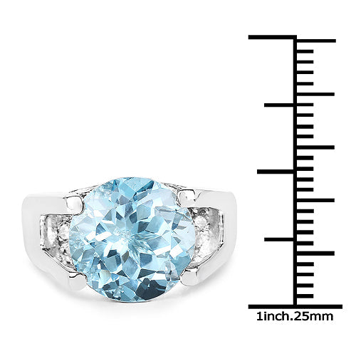 Anillo de plata de ley .925 con topacio azul auténtico de 7.21 quilates y circonitas cúbicas blancas