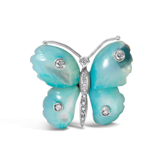 Broche con diseño de mariposa en oro blanco de 18 quilates, nácar azul y acentos de diamante (color F-G, claridad VS1-VS2)