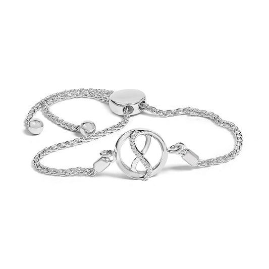 Pulsera ajustable tipo bolo con diseño de lazo y círculo con acentos de diamante en plata de ley .925