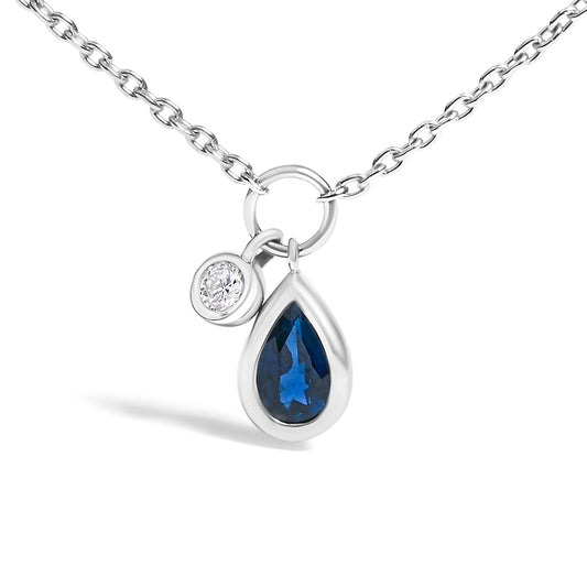 Collar con dije de zafiro azul pera de 6x4 mm y detalles de diamantes en oro blanco de 10K - 18 pulgadas