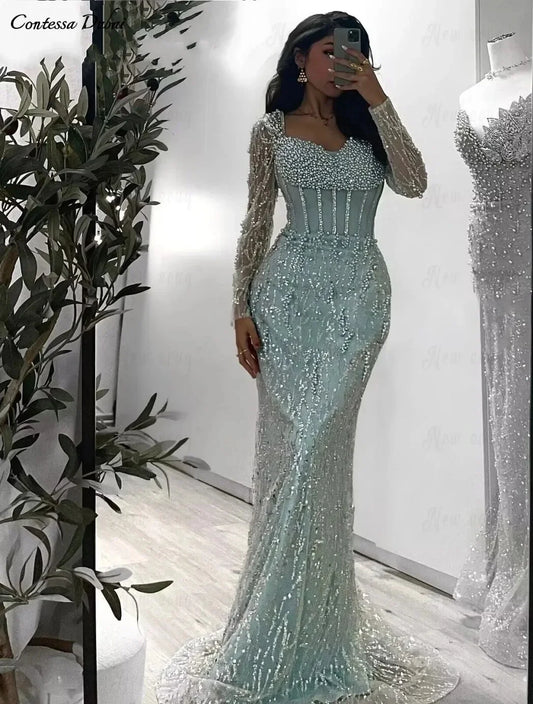 Luxury Mint Green Mermaid Evening Gown | Dubai Heavy Beaded Pearls Formal Party Dress | Exquisite Long Sleeve Illusion Corset Prom Gown | Sequin Satin Ankle-Length Trumpet Dress Luxegan
