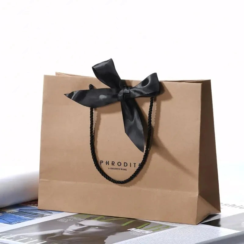 500pcs Wholesale Custom Logo Design Paper Bags | Luxury Ribbon Handle Gift Packaging for Cosmetics & Jewelry | High-Quality 250g Paperboard Shopping Bags Luxegan