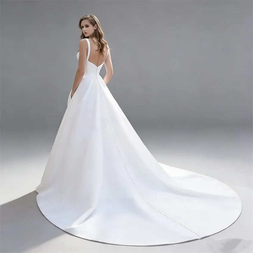 Elegant Satin A-Line Wedding Dress with Pockets | Minimalist V-Neck Spaghetti Strap Bridal Gown | Sexy Backless Floor-Length Bride Dress | Model 30249 Simple Custom Gown with Sweep Train Luxegan