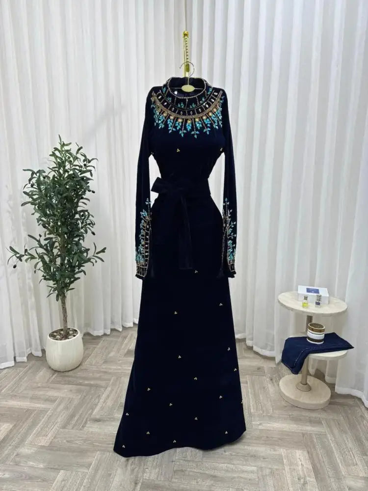 Luxury Black Velvet High-Neck Evening Dress | Exquisite Turquoise Floral Beaded Prom Gown | Full-Sleeve Floor-Length Velvet Wedding Party Dress with Self-Tie Waist Luxegan