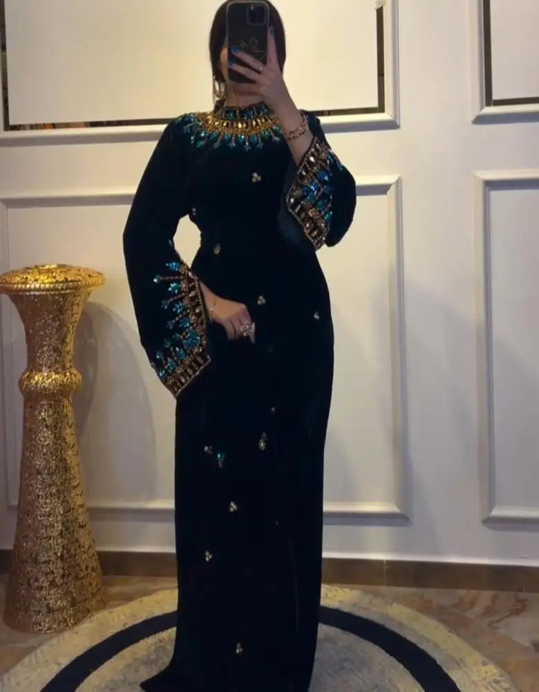 Luxury Black Velvet High-Neck Evening Dress | Exquisite Turquoise Floral Beaded Prom Gown | Full-Sleeve Floor-Length Velvet Wedding Party Dress with Self-Tie Waist Luxegan