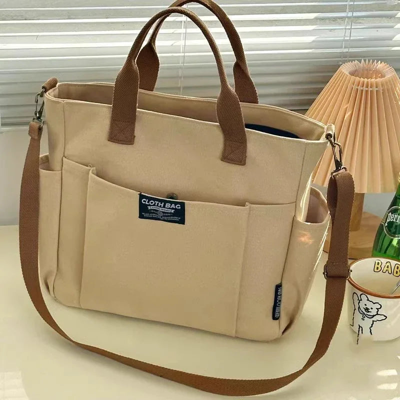 Urban Minimalist Female Student Tote Bag | Sophisticated Large Capacity Commuting Canvas Bag | Elegant Horizontal Single Shoulder & Diagonal Crossbody | Fashion-Forward Portable Portable Canvas Satchel Luxegan