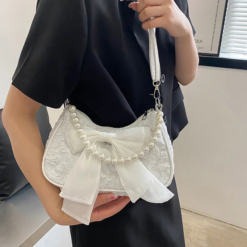 White Folds Pop Retro Bow Bag | Female Pearl Handle New Fashion Pearl Armpit Shoulder & Crossbody Bag Luxegan