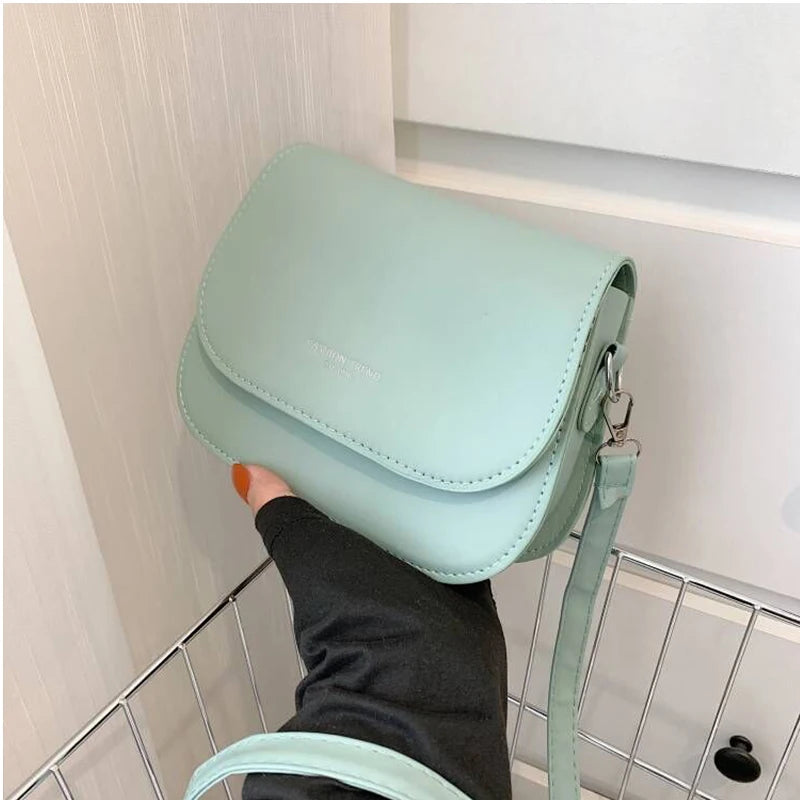 Trendy Saddle Shoulder Bag for Women | Sophisticated PU Leather Crossbody | Simple Solid Color Flap Messenger Bag | Fashion-Forward Designer Pouch for Versatile Daily Matching Luxegan