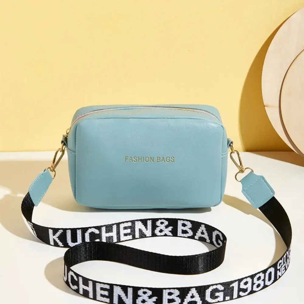 Simple Designer Wide Letter Strap Handbag | Sophisticated PU Leather Square Shoulder Bag | Elegant Small Phone Crossbody Purse | Fashion-Forward Travel Sac for Women & Unisex Styling Luxegan