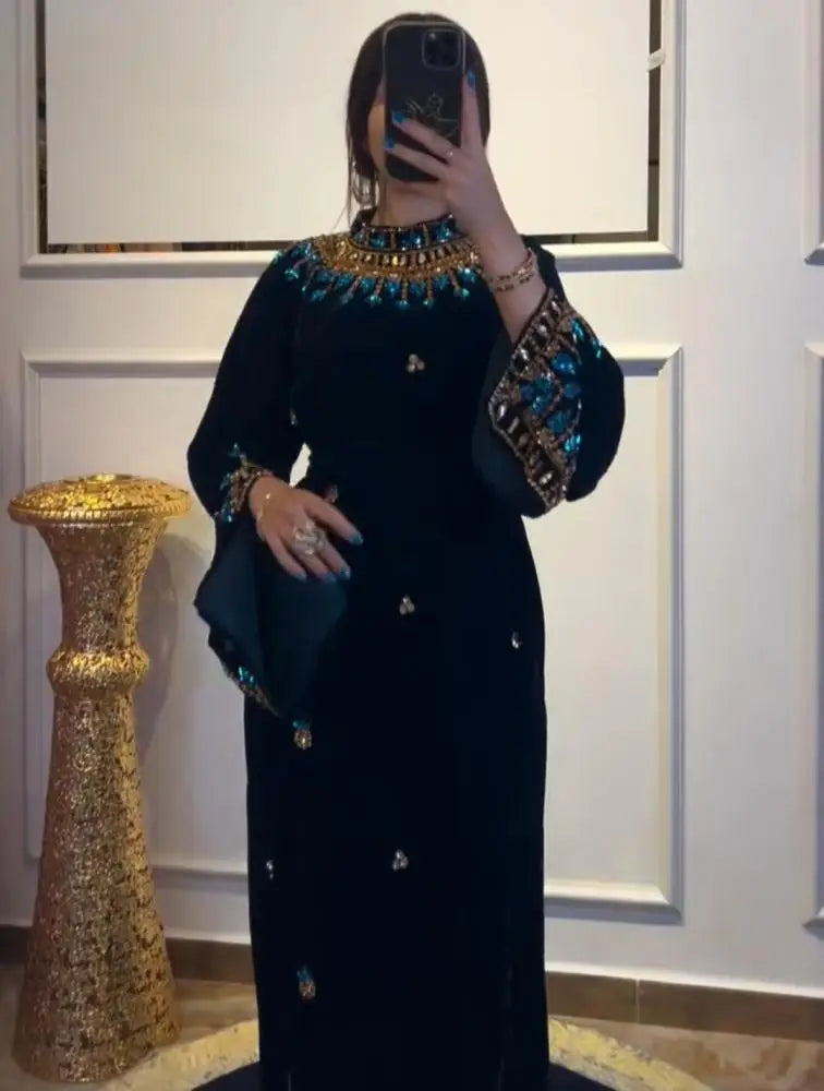 Luxury Black Velvet High-Neck Evening Dress | Exquisite Turquoise Floral Beaded Prom Gown | Full-Sleeve Floor-Length Velvet Wedding Party Dress with Self-Tie Waist Luxegan