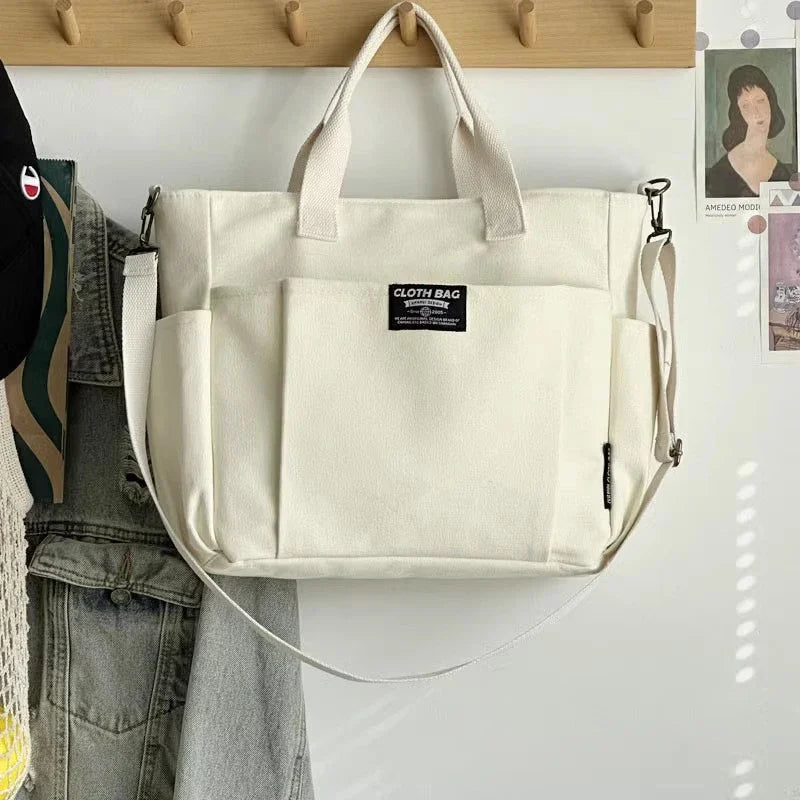 Urban Minimalist Female Student Tote Bag | Sophisticated Large Capacity Commuting Canvas Bag | Elegant Horizontal Single Shoulder & Diagonal Crossbody | Fashion-Forward Portable Portable Canvas Satchel Luxegan
