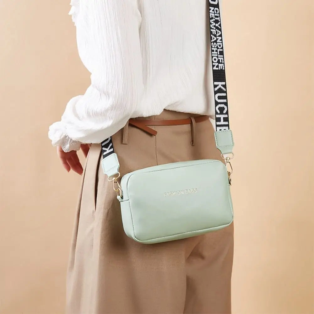 Simple Designer Wide Letter Strap Handbag | Sophisticated PU Leather Square Shoulder Bag | Elegant Small Phone Crossbody Purse | Fashion-Forward Travel Sac for Women & Unisex Styling Luxegan