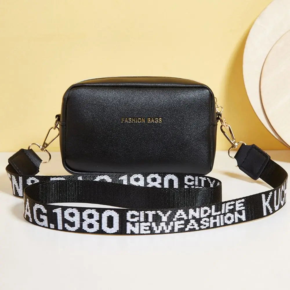 Simple Designer Wide Letter Strap Handbag | Sophisticated PU Leather Square Shoulder Bag | Elegant Small Phone Crossbody Purse | Fashion-Forward Travel Sac for Women & Unisex Styling Luxegan