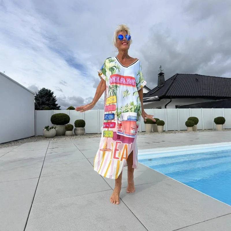 Women's European and American Vacation Long Dress | Elegant Temperament V-Neck Short-Sleeve Midi Purse | Casual Side-Split Printed A-Line Dress | Premium All-Season Pullover Model YMF6624 Luxegan