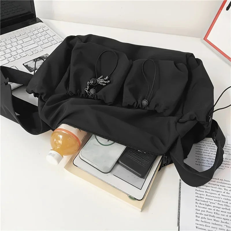 Fashionable Drawstring Crossbody Messenger Bag | Spacious & Secure Zippered Nylon Tote | Unisex Casual Shoulder Bag with Stylish Bag Charm Luxegan