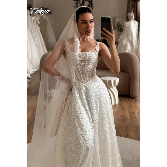Vestidos de Novia Blancos Personalizados Tokyo Corte A Tirantes Finos Sin Mangas Encaje Vestidos de Novia Cola de Corte Elegantes
