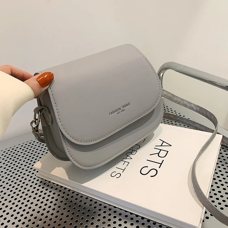Trendy Saddle Shoulder Bag for Women | Sophisticated PU Leather Crossbody | Simple Solid Color Flap Messenger Bag | Fashion-Forward Designer Pouch for Versatile Daily Matching Luxegan