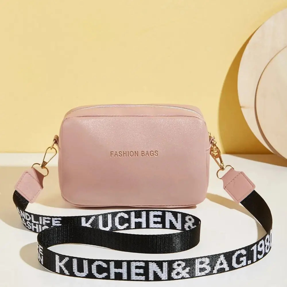 Simple Designer Wide Letter Strap Handbag | Sophisticated PU Leather Square Shoulder Bag | Elegant Small Phone Crossbody Purse | Fashion-Forward Travel Sac for Women & Unisex Styling Luxegan