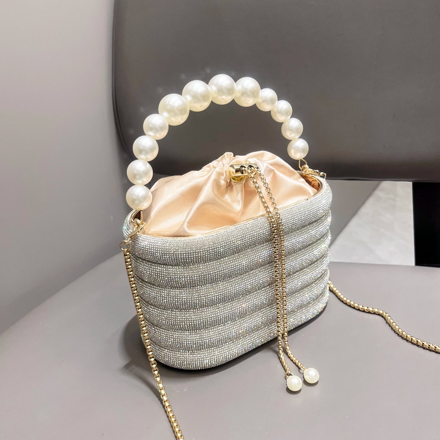 Luxury Designer Rhinestone Evening Clutch Bag | Shiny Crystal Bucket Purse with Metallic Handle | Shimmering Metallic Wedding & Party Handbag | Glamorous Crystal-Encrusted Shoulder Bag Luxegan