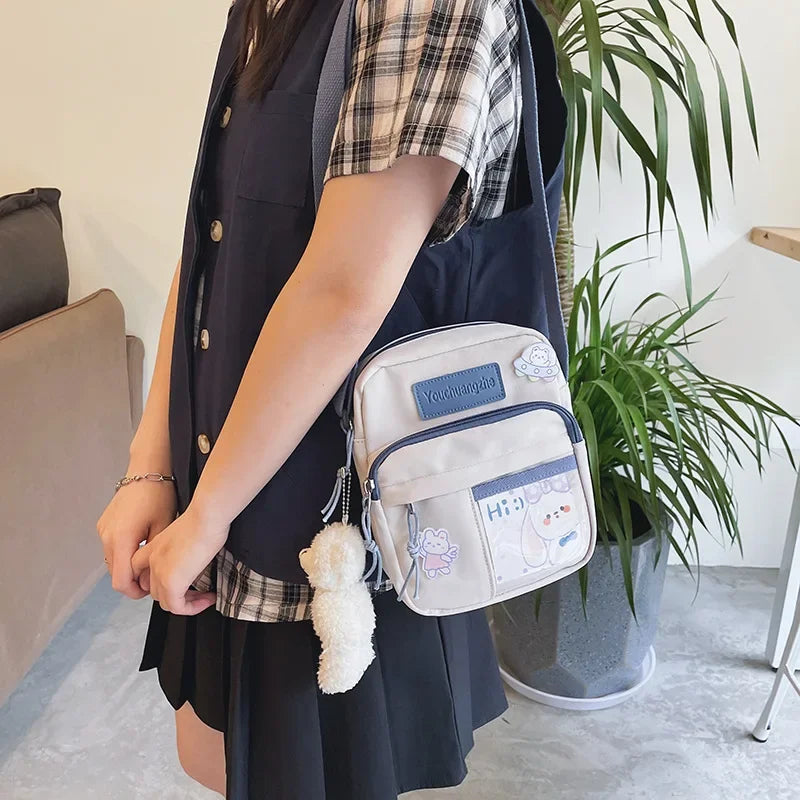 Cute Clear Kawaii Canvas Bag | Harajuku Cartoon Messenger Bag for Girls | Sophisticated Small Patchwork Shoulder Pouch | Fashion-Forward Nylon Cellphone Purse with Silt Pocket Luxegan