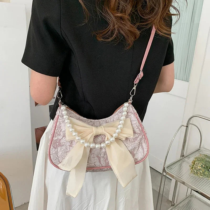 White Folds Pop Retro Bow Bag | Female Pearl Handle New Fashion Pearl Armpit Shoulder & Crossbody Bag Luxegan