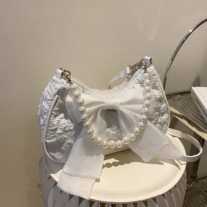 White Folds Pop Retro Bow Bag | Female Pearl Handle New Fashion Pearl Armpit Shoulder & Crossbody Bag Luxegan