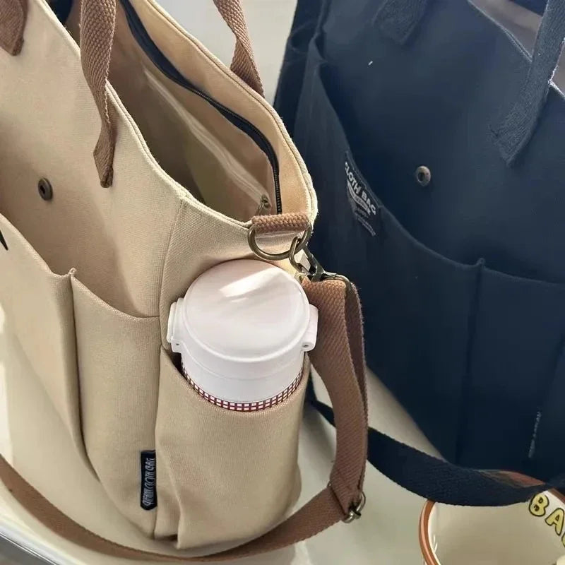 Urban Minimalist Female Student Tote Bag | Sophisticated Large Capacity Commuting Canvas Bag | Elegant Horizontal Single Shoulder & Diagonal Crossbody | Fashion-Forward Portable Portable Canvas Satchel Luxegan