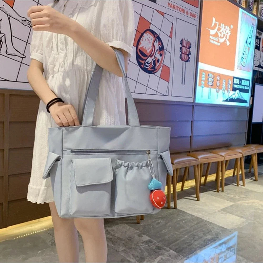 New Solid-Color Versatile Commuter Bag | Sophisticated Strawberry-Pendant Handbag | Elegant College-Style Large Capacity Shoulder Bag | "Dignified" Soft Oxford Tote for Multi-Season Styling Luxegan