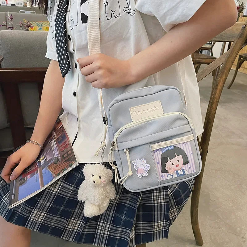 Cute Clear Kawaii Canvas Bag | Harajuku Cartoon Messenger Bag for Girls | Sophisticated Small Patchwork Shoulder Pouch | Fashion-Forward Nylon Cellphone Purse with Silt Pocket Luxegan