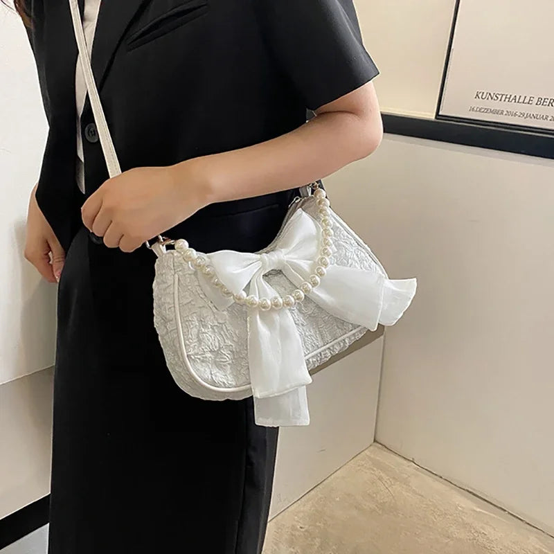 White Folds Pop Retro Bow Bag | Female Pearl Handle New Fashion Pearl Armpit Shoulder & Crossbody Bag Luxegan