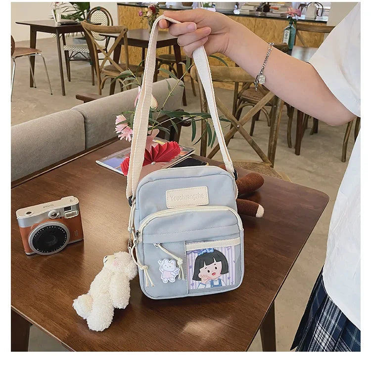 Cute Clear Kawaii Canvas Bag | Harajuku Cartoon Messenger Bag for Girls | Sophisticated Small Patchwork Shoulder Pouch | Fashion-Forward Nylon Cellphone Purse with Silt Pocket Luxegan