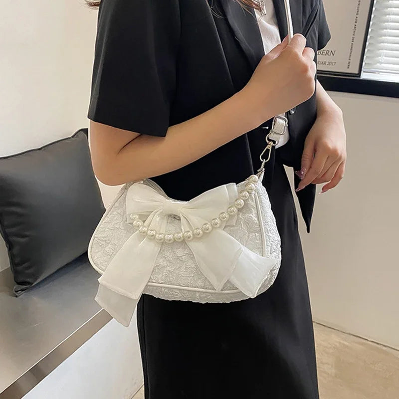 White Folds Pop Retro Bow Bag | Female Pearl Handle New Fashion Pearl Armpit Shoulder & Crossbody Bag Luxegan