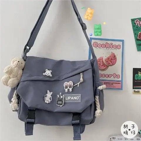 Preppy Style Pins-Decor Messenger Bag | Sophisticated Large-Capacity School Bag | Elegant Release-Buckle Flap Crossbody | "Dignified" Soft Nylon Satchel for Versatile Youth Styling Luxegan