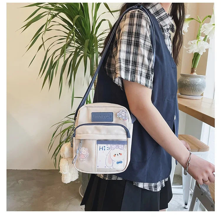 Cute Clear Kawaii Canvas Bag | Harajuku Cartoon Messenger Bag for Girls | Sophisticated Small Patchwork Shoulder Pouch | Fashion-Forward Nylon Cellphone Purse with Silt Pocket Luxegan
