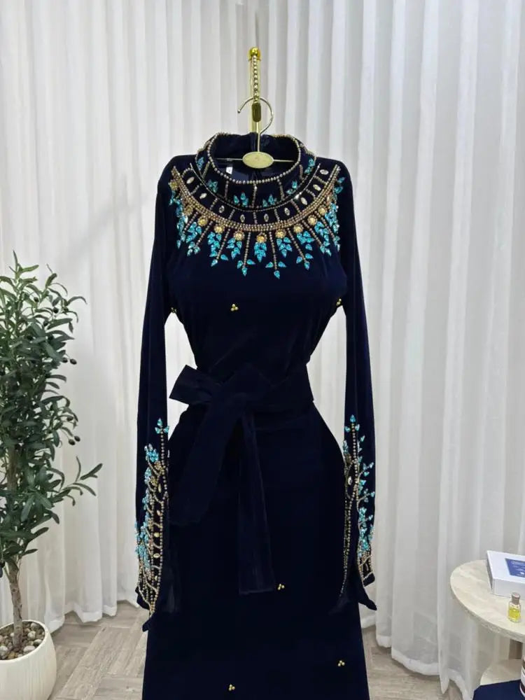 Luxury Black Velvet High-Neck Evening Dress | Exquisite Turquoise Floral Beaded Prom Gown | Full-Sleeve Floor-Length Velvet Wedding Party Dress with Self-Tie Waist Luxegan